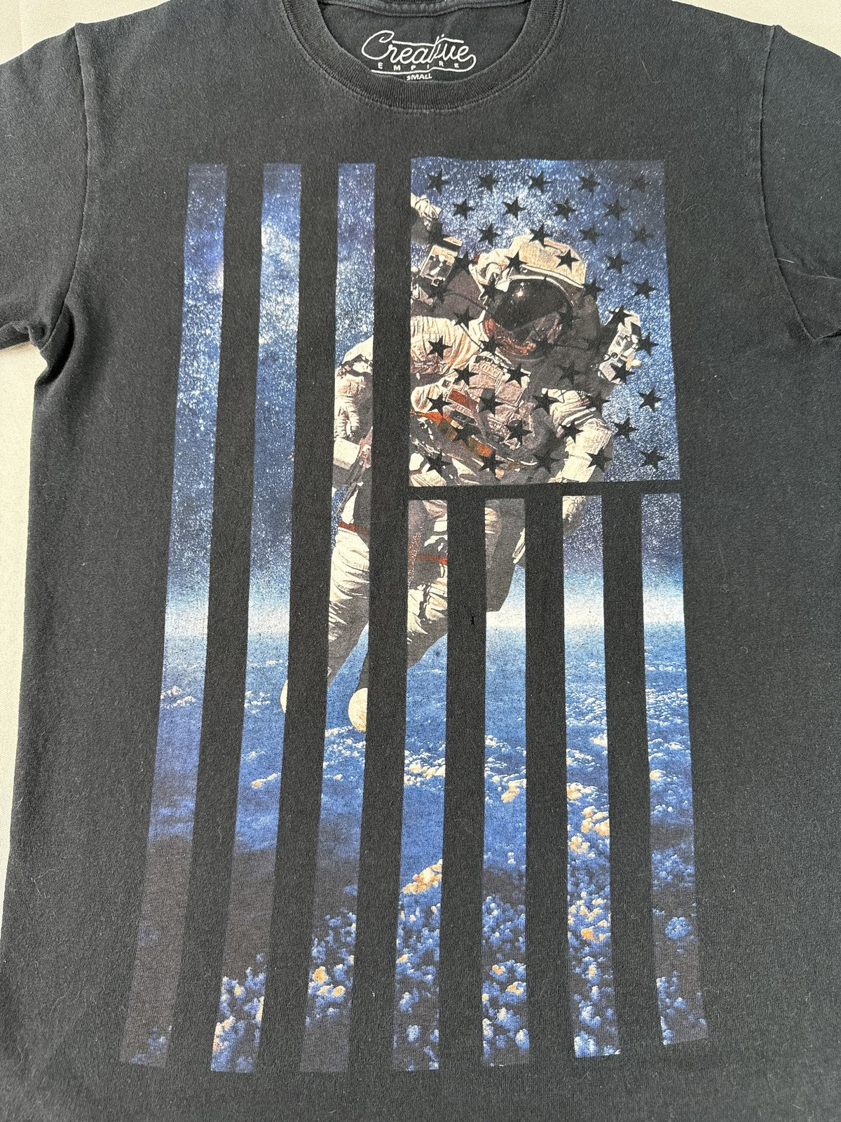 Creative Astronaut Flag Graphic Tee SMALL Black Cotton Crewneck Short Sleeve Men