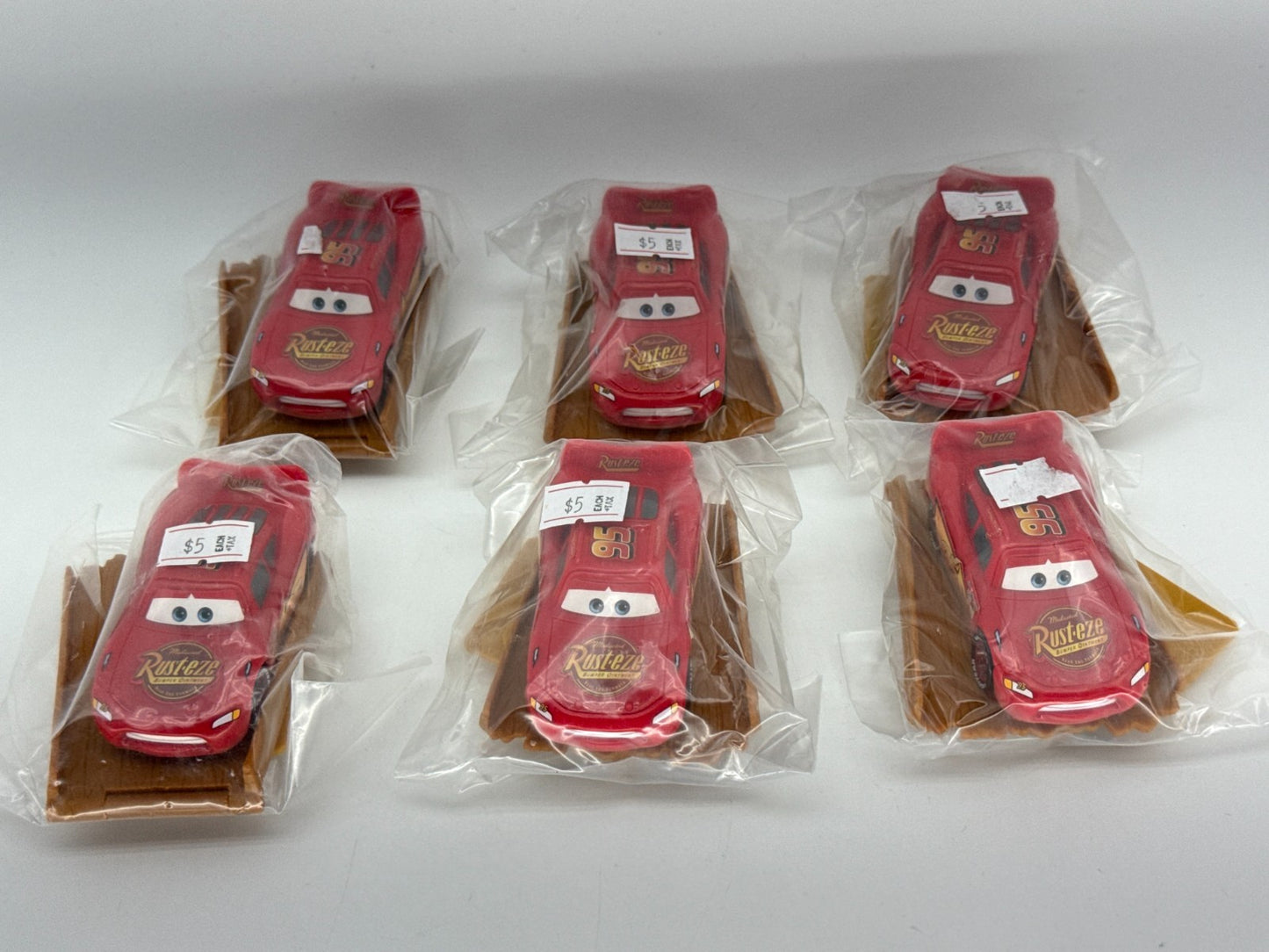Disney Pixar Cars Lightning McQueen 95 Rusteze Red Toy Car Lot w Base Apparel